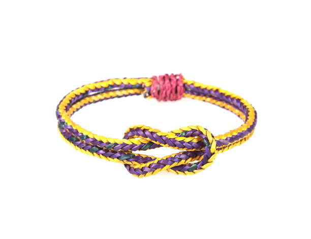 istock wristband made from woven straw on a white background. 1067661386