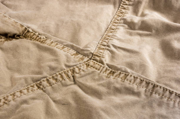 istock clothing items washed cotton fabric texture with seams 1067661548