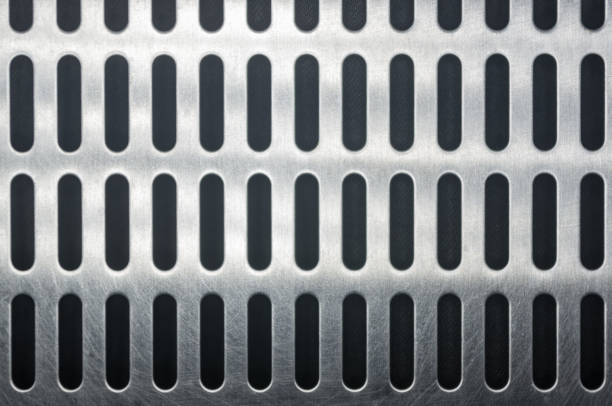 istock stainless steel grating with oblong holes, close-up 1067664406