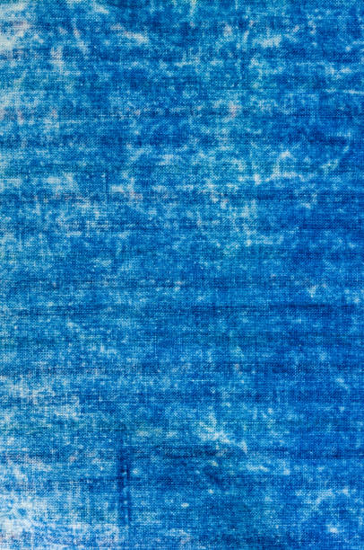 istock Blue washed faded jeans striped texture with seams 1067666970