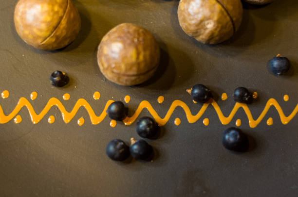 istock macadamia, Australian nut in a ceramic plate 1067668226