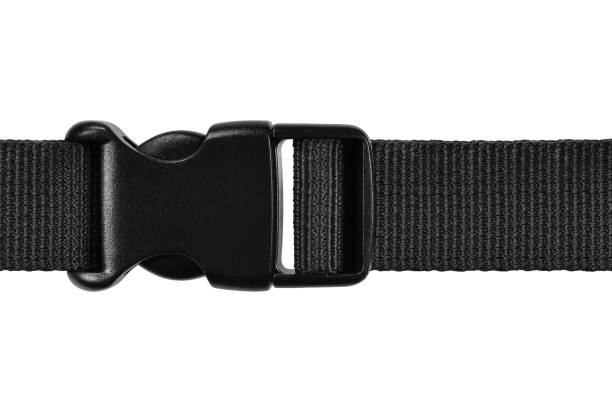 Black side release acculoc buckle plastic clasp, quick nylon belt rope lock strap, isolated macro closeup, large detailed horizontal accessory studio shot stock photo