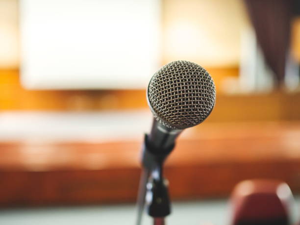 istock Close up microphone in conference room 1067671028