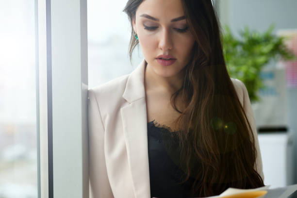 istock Beautiful smiling girl at workplace look in camera 1067671264