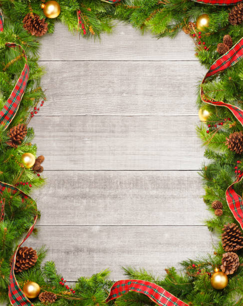 Christmas Garland On Whitewashed Boards A frame created by a Christmas garland of pine boughs and Christmas ornaments on several wooden whitewashed planks. wreath photos stock pictures, royalty-free photos & images