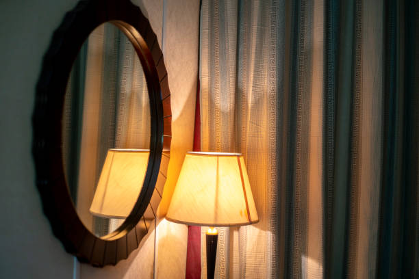 istock old-fashioned lamp and mirror of hotel room 1067673328