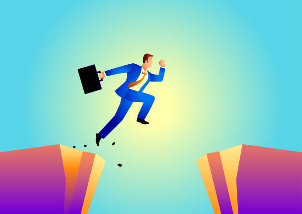 istock Businessman jumps over the ravine 1067675674