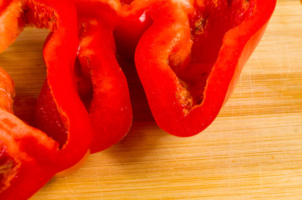 istock sliced fresh red paprika, bell pepper on bamboo cutting board 1067676898