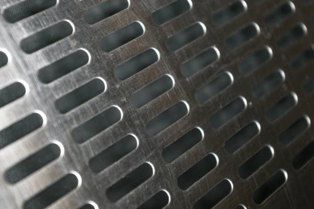 istock stainless steel grating with oblong holes, close-up 1067677668
