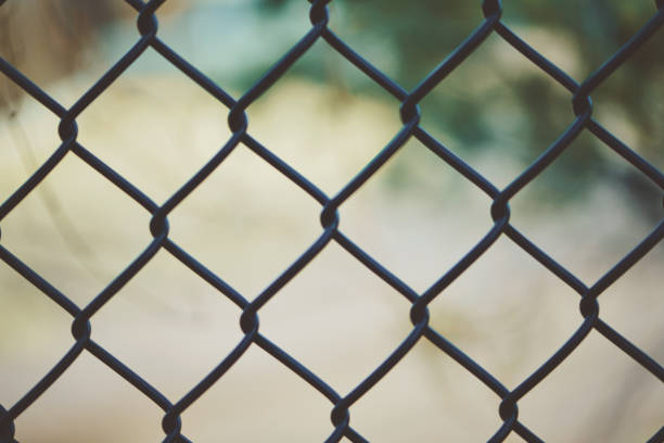 istock Abstract background with chain link fence 1067678192