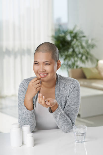 istock Cancer survivor taking pills 1067688942