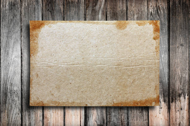 istock Old paper on the wood background 1067694152