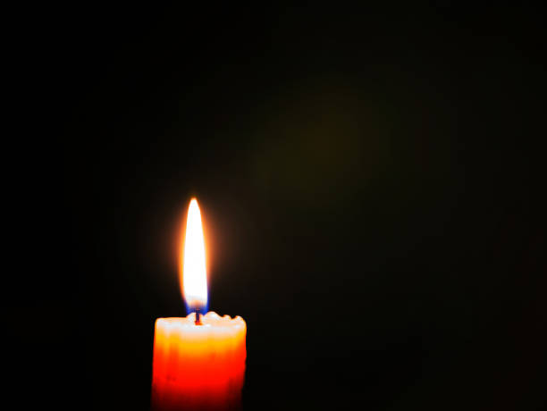 istock Burning candle in the dark. 1067694210