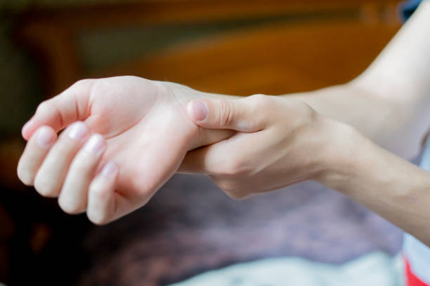 istock close up hand touch arm feeling pain f 1067694710