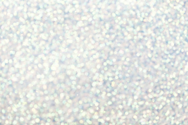 istock Blurred shiny white background with sparkling lights. 1067696670