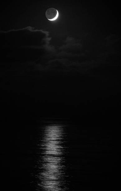 istock Moon In Black and White, Pacific Ocean. 1067701254