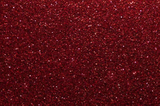istock Dark red sparkling background from small sequins, closeup. Brilliant backdrop. 1067703822