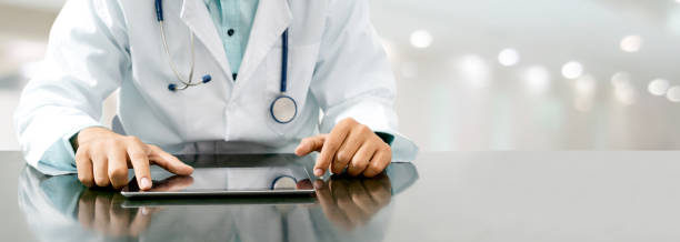 istock Doctor with tablet computer at hospital office. 1067707250