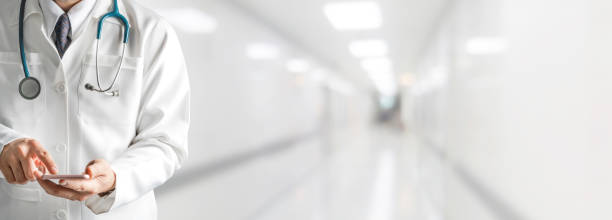 istock Male doctor using mobile phone at hospital. 1067707320