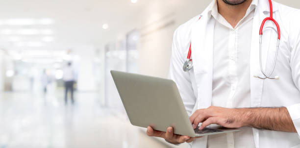 istock Doctor using laptop computer at the hospital. 1067707532