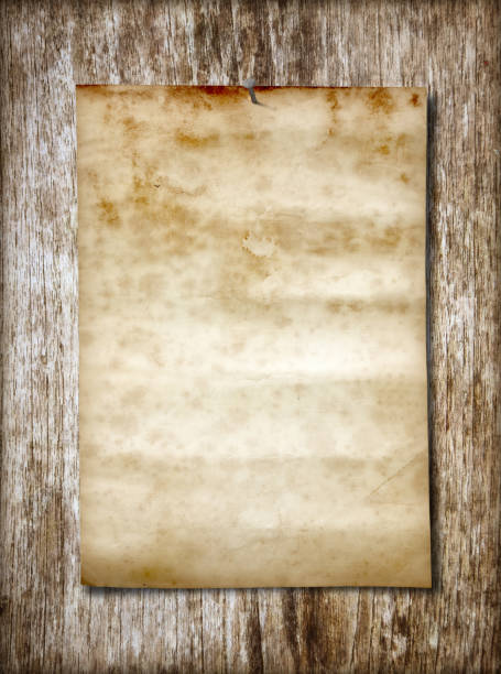istock Old paper on wood 1067709874