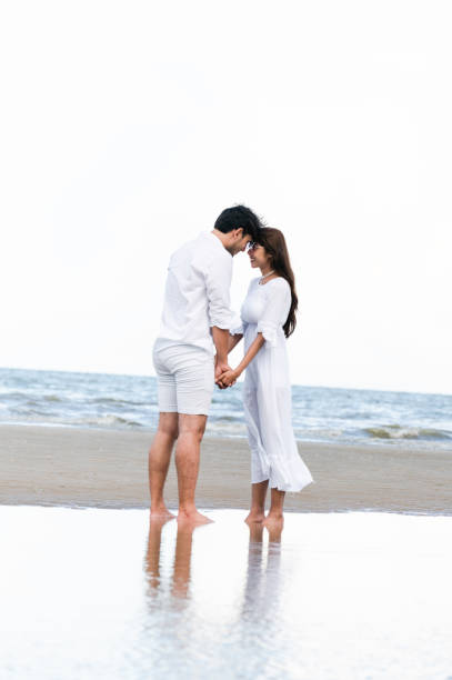 istock Couple going honeymoon on tropical beach in summer 1067709914