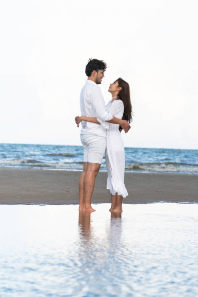 istock Couple going honeymoon on tropical beach in summer 1067709926