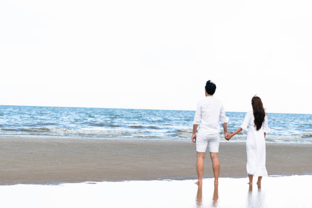 istock Couple going honeymoon on tropical beach in summer 1067709984