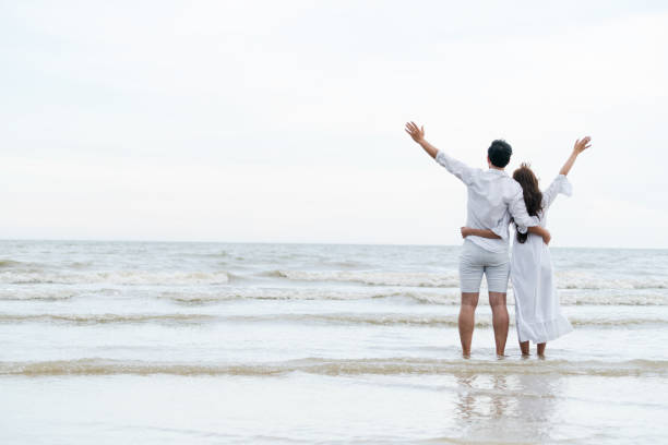 istock Couple going honeymoon on tropical beach in summer 1067710116