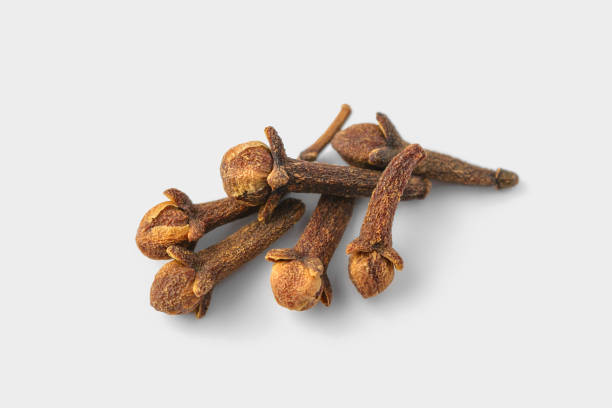 istock A group of cloves on a white background 1067713000