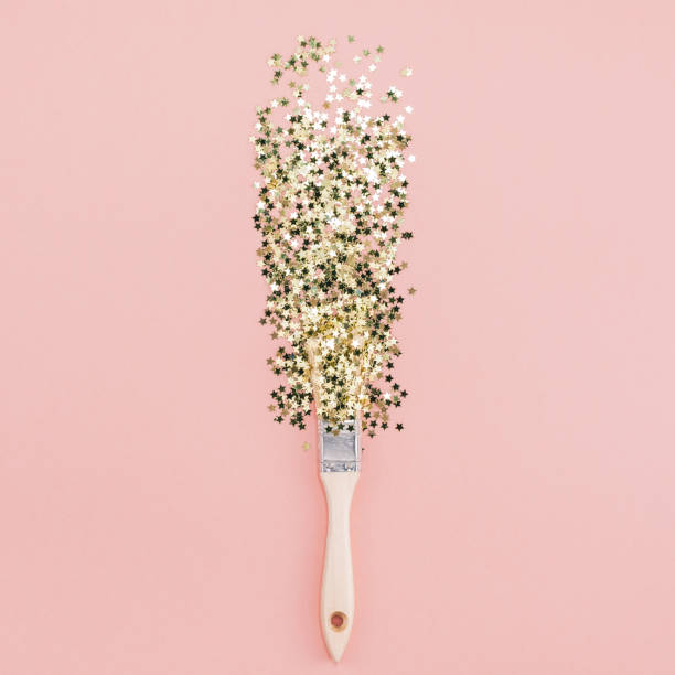 istock Surreal Paint brush drawing golden stars confetti 1067719306