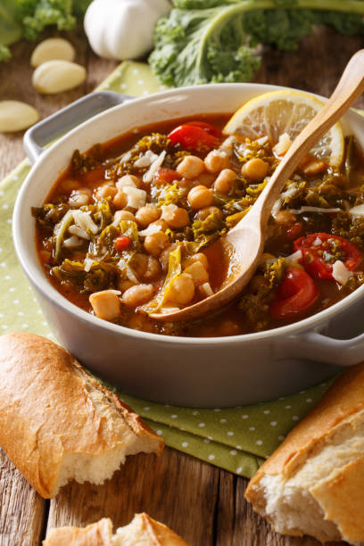 istock Stewed kale cabbage with chickpeas and vegetables close-up. vertical 1067719854