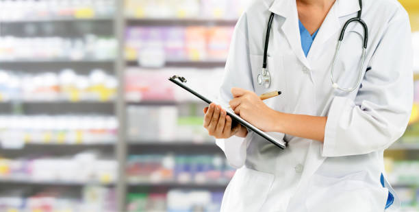 istock Woman pharmacist working at pharmacy. 1067720002