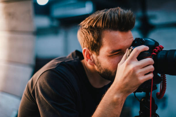 istock Photographer taking a photo with a dslr 1067723488