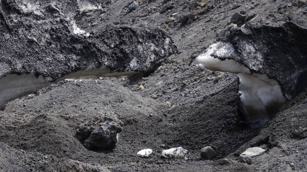 istock Snow and black earth from Etna in Sicily 1067733104