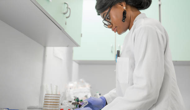 istock Female Researcher Working in Laboratory 1067733116