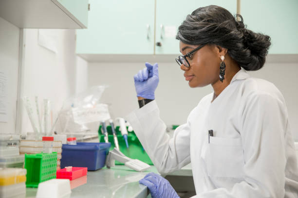 istock Female African Researcher Working in Laboratory 1067733218
