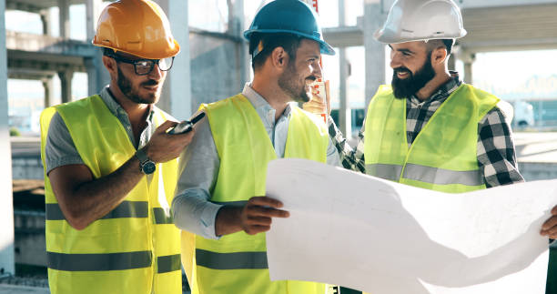 istock Portrait of construction engineers working on building site 1067734280