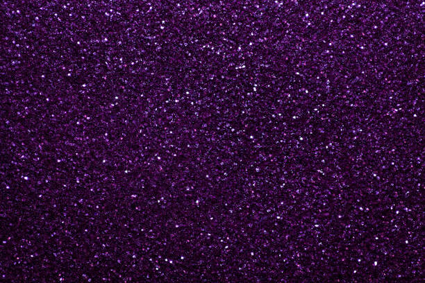 istock Dark purple sparkling background from small sequins, closeup. Brilliant backdrop. 1067736736