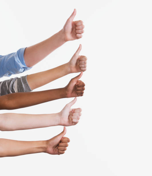 istock Five stacked hands giving enthusiastic thumbs-up signals 1067740908