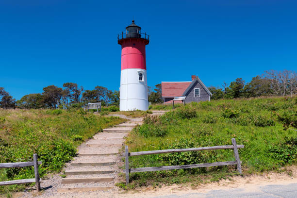 red and white colors lighthouse at cape code - nauset beach imagens e fotografias de stock