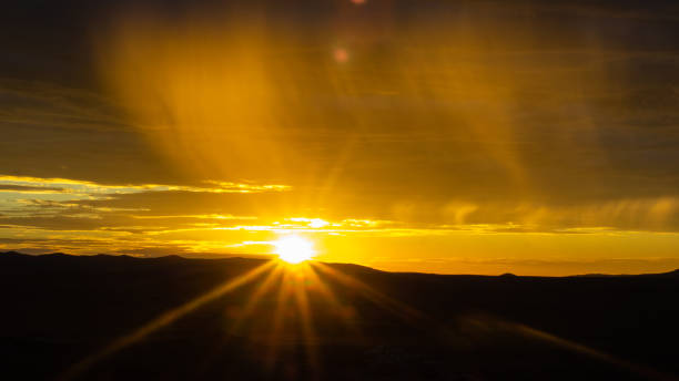 istock Rain showers over the desert at sunset 1067744086