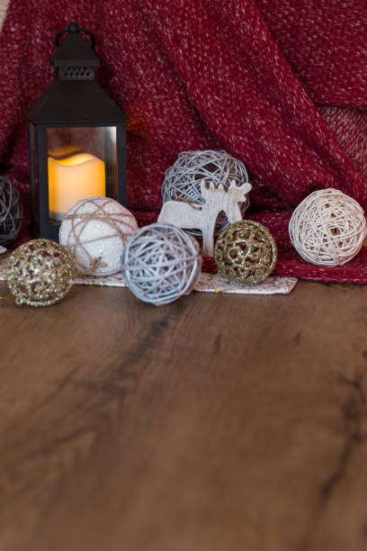 istock Christmas decorations on wooden and red background 1067748534