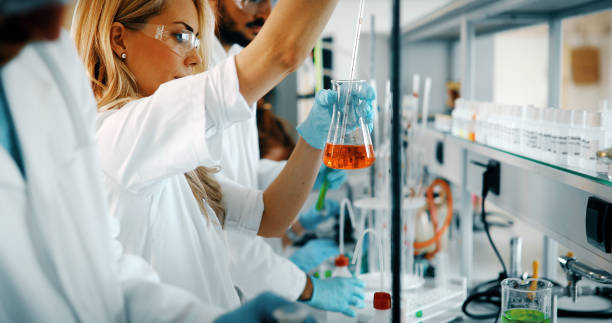 istock Attractive student of chemistry working in laboratory 1067750118