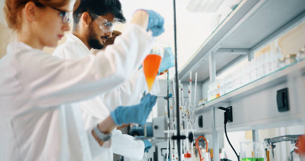 istock Attractive student of chemistry working in laboratory 1067750206