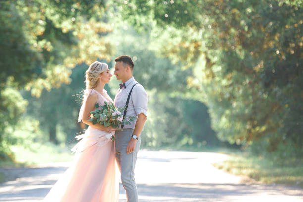 istock wedding couple on the nature in summer day. 1067751604