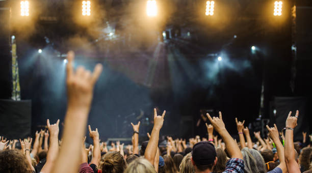 istock Hands raised showing a heavy metal rock sign, devil horns 1067753032