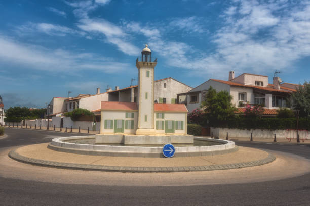 istock Saintes-Maries-de-la-Mer, small mediterranean town, road ring decorated with a lighthouse 1067753404