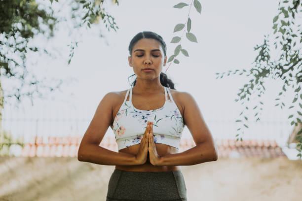 istock Woman practicing yoga for relaxation 1067757254