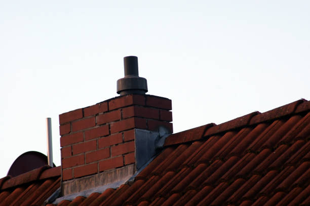 istock Chimney eating on the house roof 1067761870